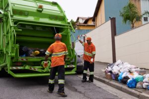 trash-people-working-with-garbage-truck-waste-management-service-maintenance-urban-cleaning-men-outdoor-with-industrial-sanitation-collection-rubbish-infrastructure-min